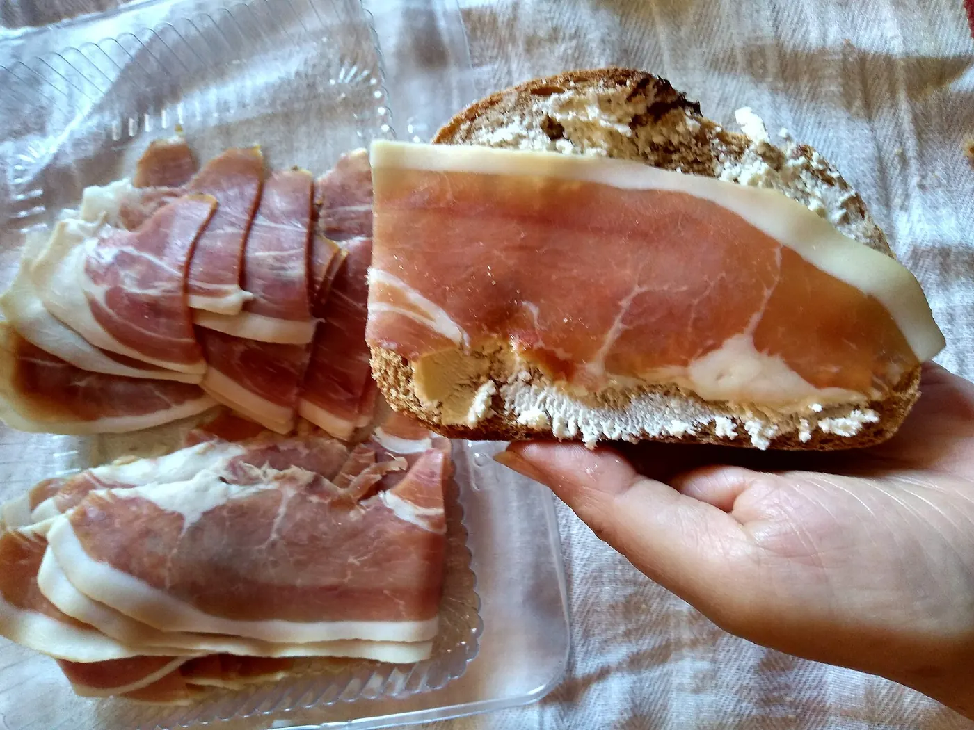 Kajmak and cured ham on bread