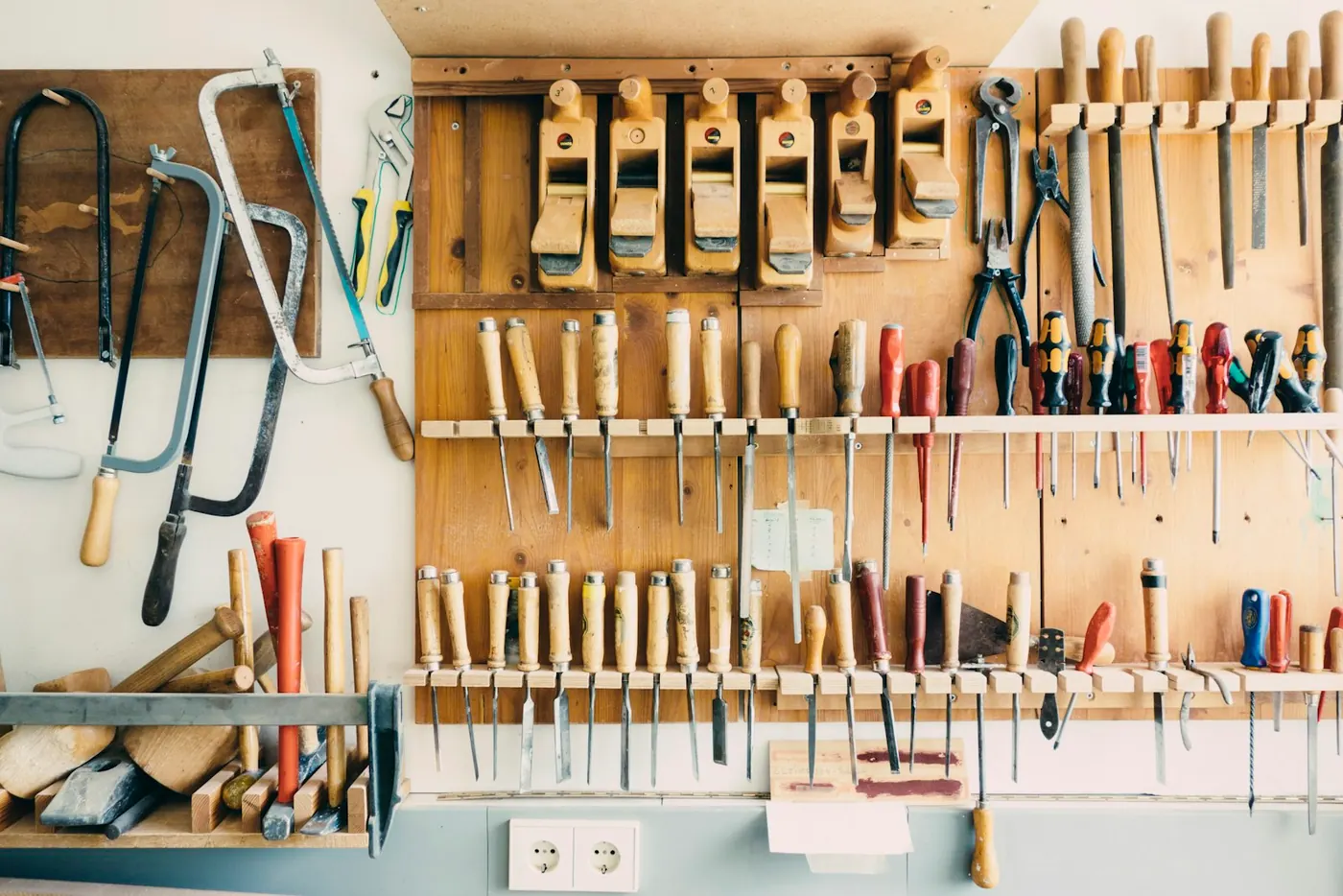 Hand tools hanging in a workshop