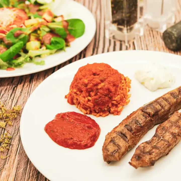Grilled meat with red pepper relish